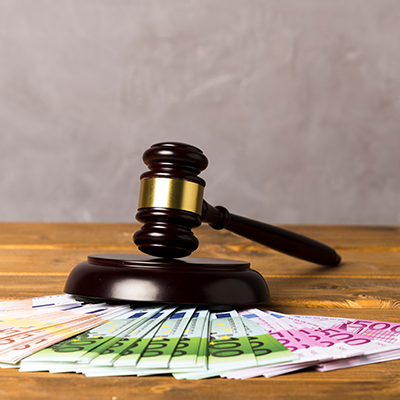 Assortment with judge gavel and banknotes