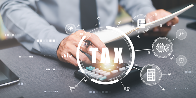 Businessman is handling paperwork and calculating tax rates and business finance budget ,